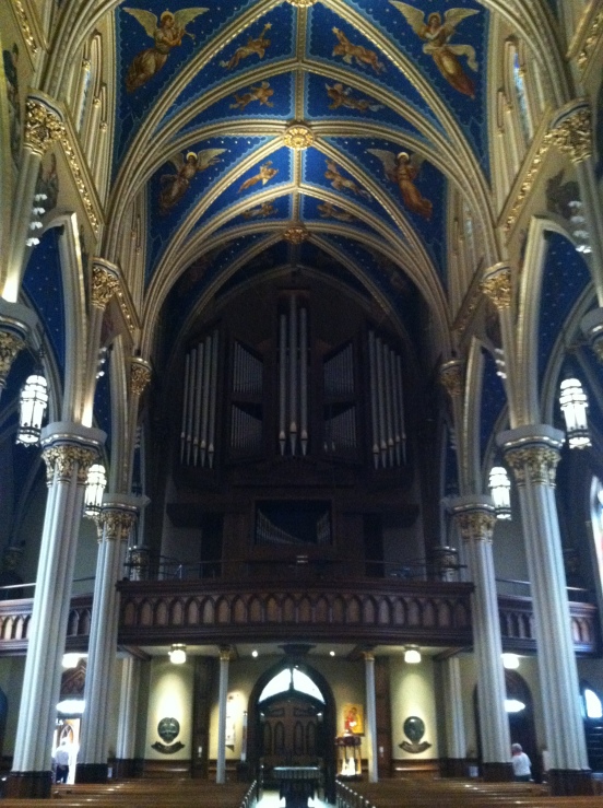 facing the back, the choir loft and organ pipes