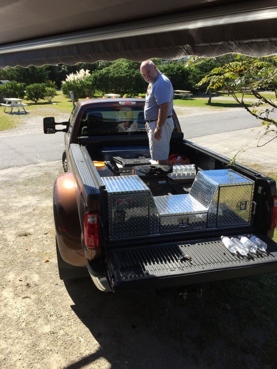 hubby getting stuff out of the back of the truck - notice his new toolbox? 