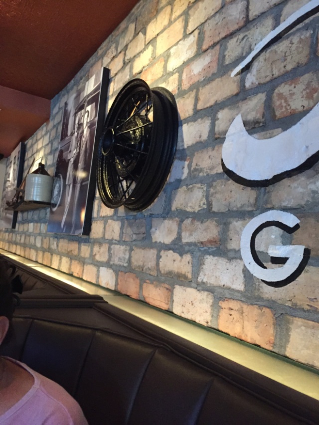 where else would you see hubcaps on the wall?