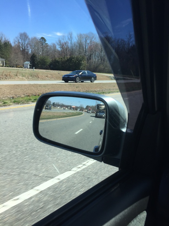 might be hard to see - but if you look closely you will be able to see - I got both rigs in the mirror - coolest pic ever!