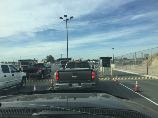 following Red through the gate into the parking lot on the USA side